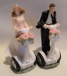 Preview: Tortenfigur Tortenaufsatz zur Hochzeit Brautpaar auf Segway 16 cm TA0125